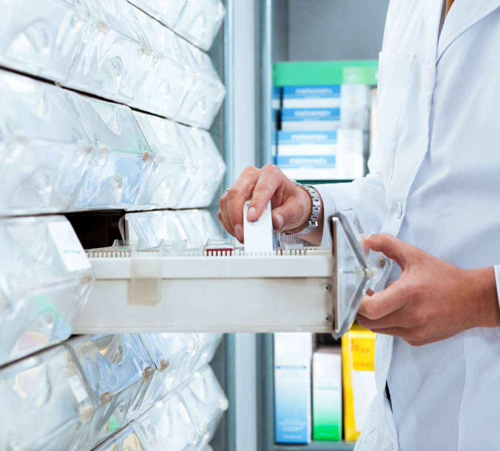 Pharmacy technician pulling stock at the dispensing bench