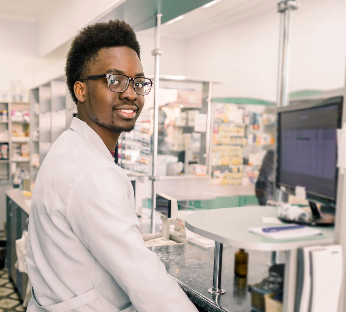 Pharmacy technician preparing medication in a healthcare environment